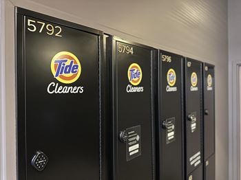 a row of tide lockers with the logos of the tide cleaners